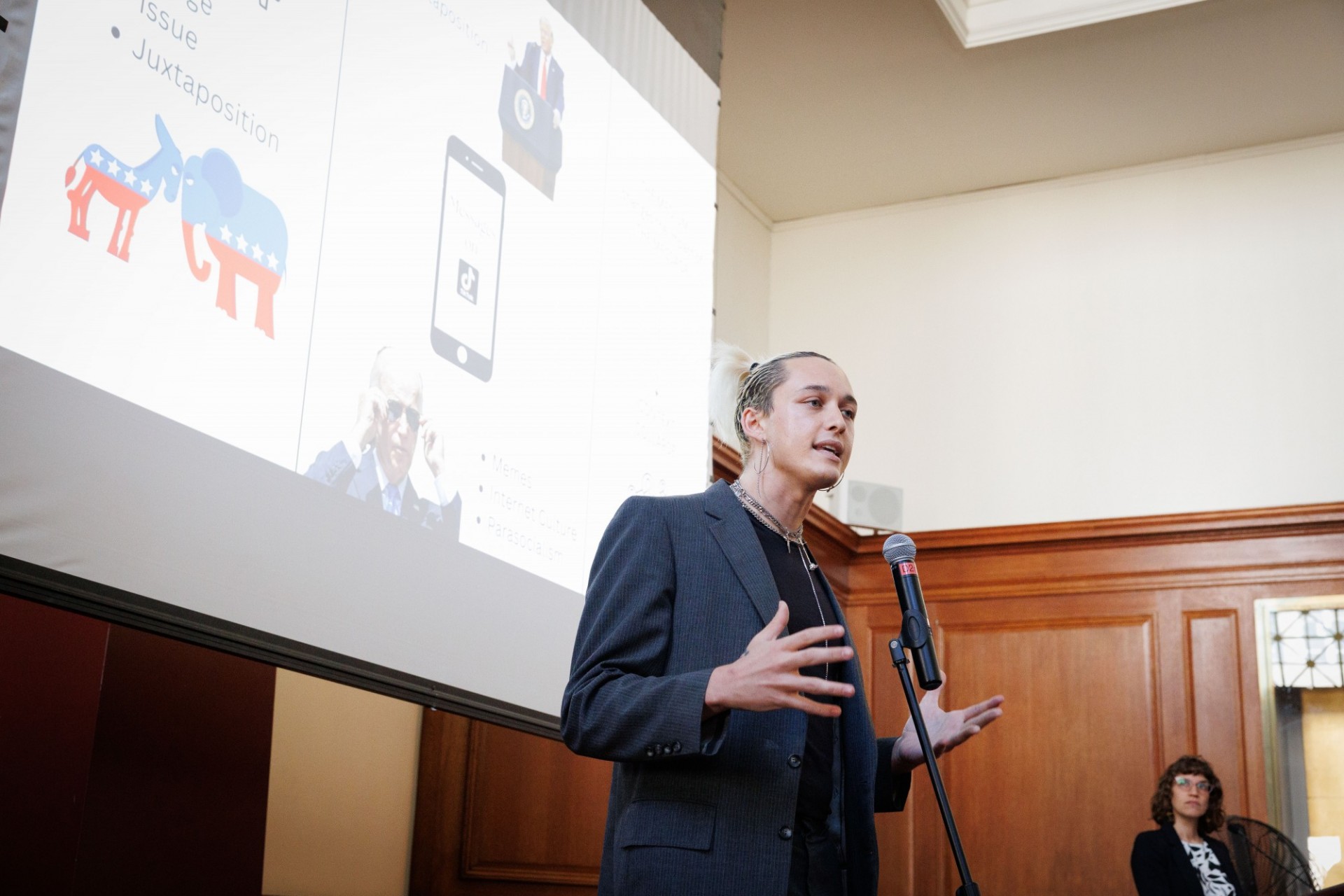 Lulu Bird (Global Thought) discussing the influence of TikTok on the presidential race Man standing giving presentation in front of an audience