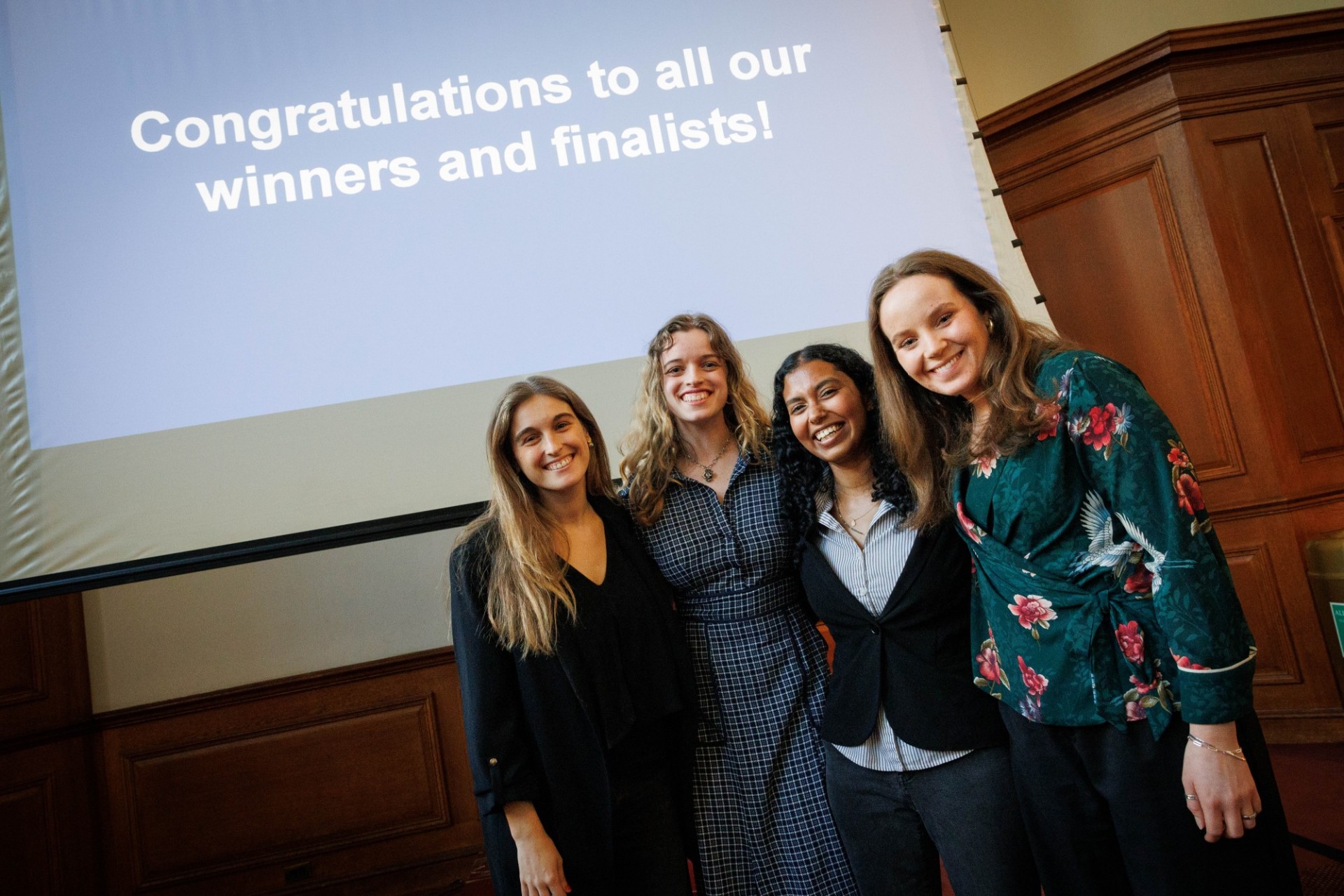 SynThesis 2024 prize winners (L to R): Leyre Santos Vidal, Isabella Giancola, Anusikha Halder, Lucy Holland 4 women standing together, smiling