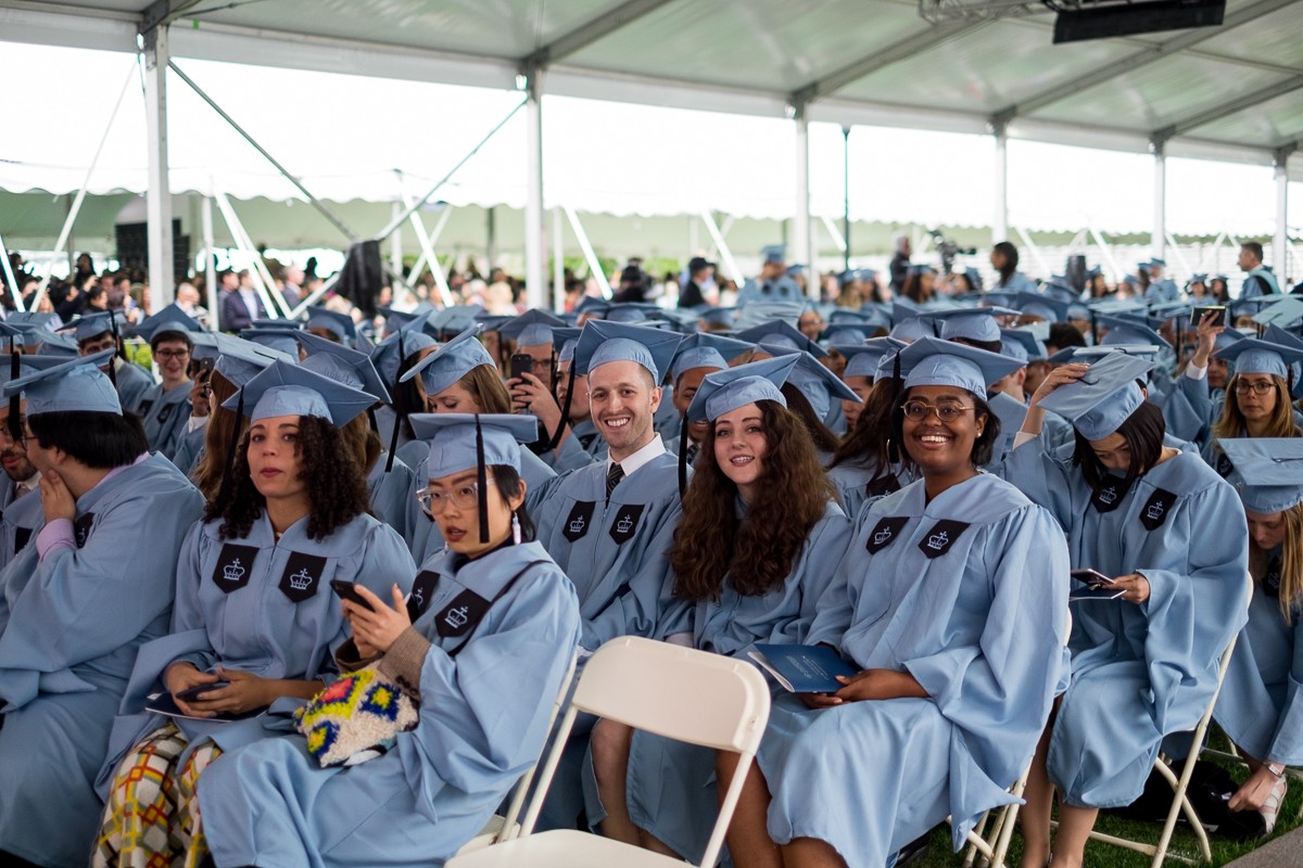 MA graduates take their seats.