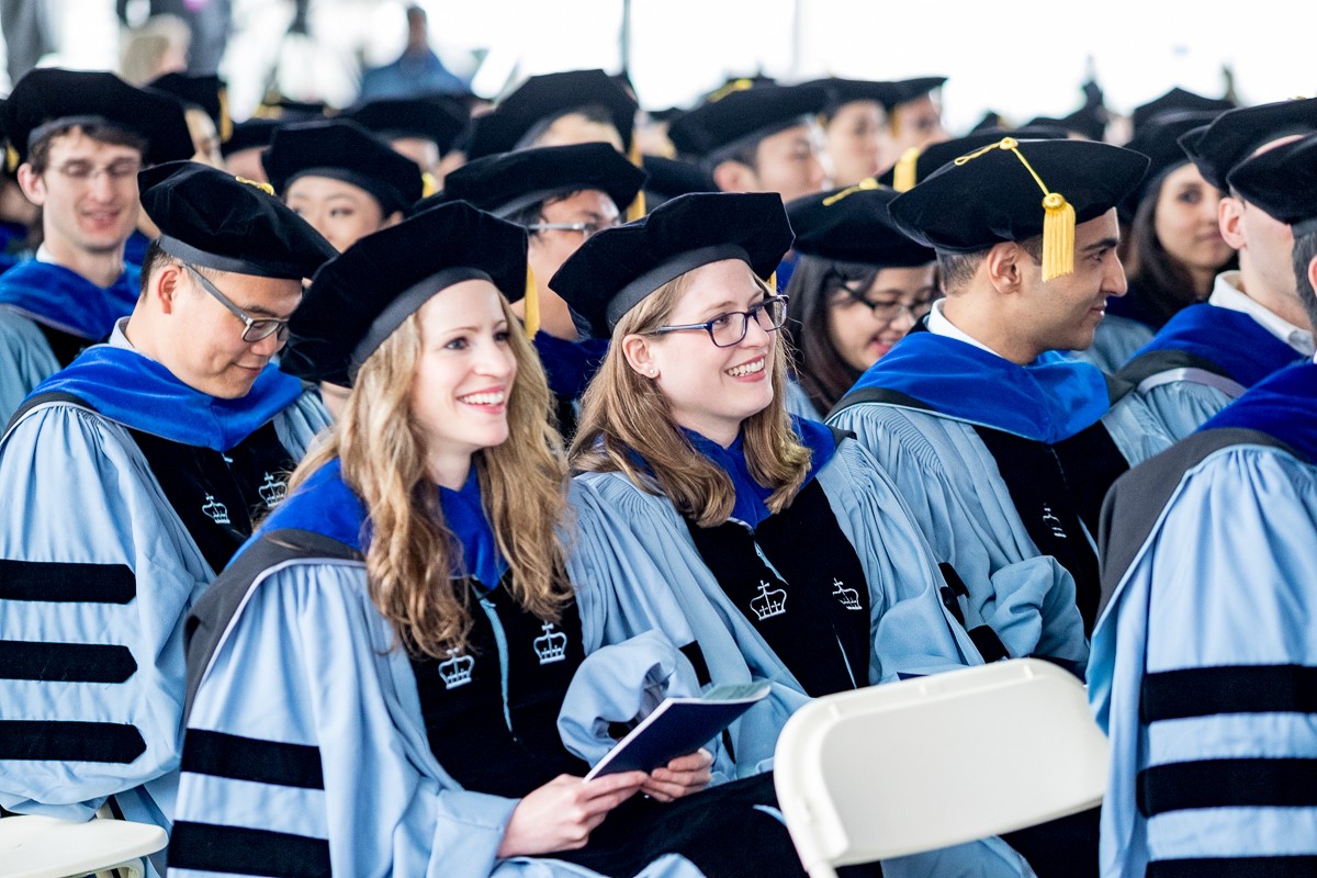 PhD candidates take their seats for the ceremony.