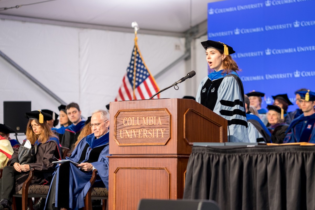 Yelena Zhuravlev, a graduate of the PhD program in Genetics and Development, delivers the candidate’s remarks.