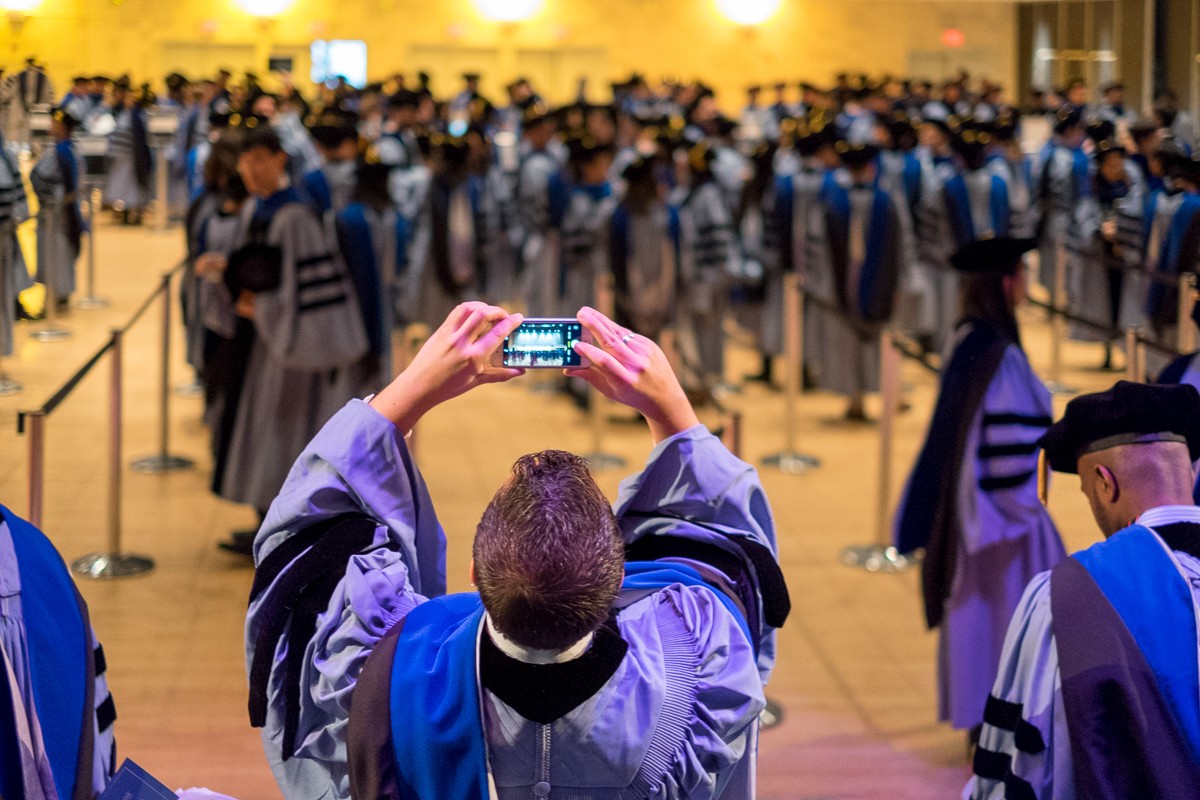 PhD graduates line up in Lerner Hall. PhD graduates line up in Lerner Hall.