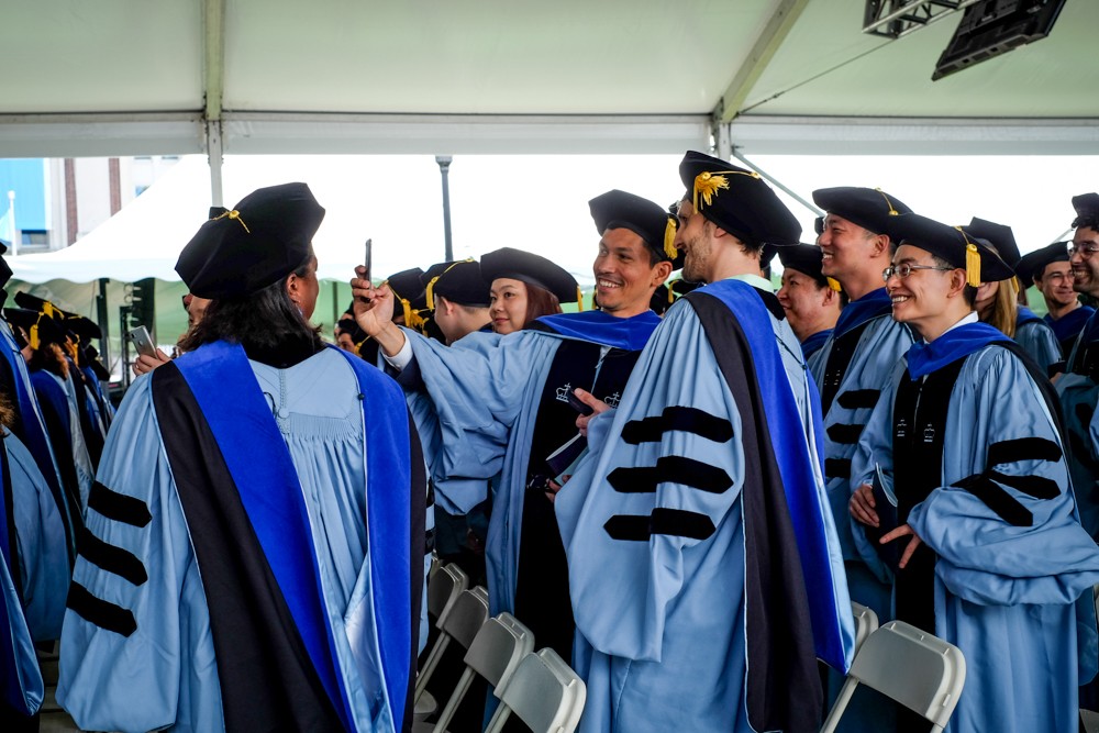 Before the speeches begin, students take a pre-ceremony selfie. Before the speeches begin, students take a pre-ceremony selfie.