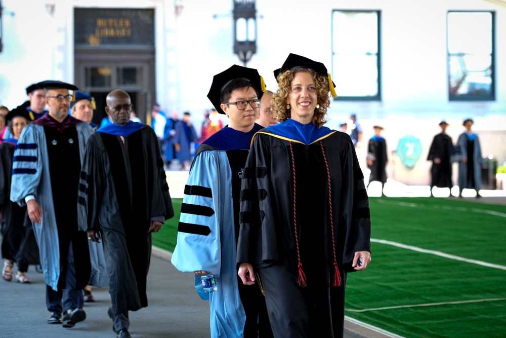 Andrea Solomon, PhD, Vice Dean of GSAS, leads the faculty procession.