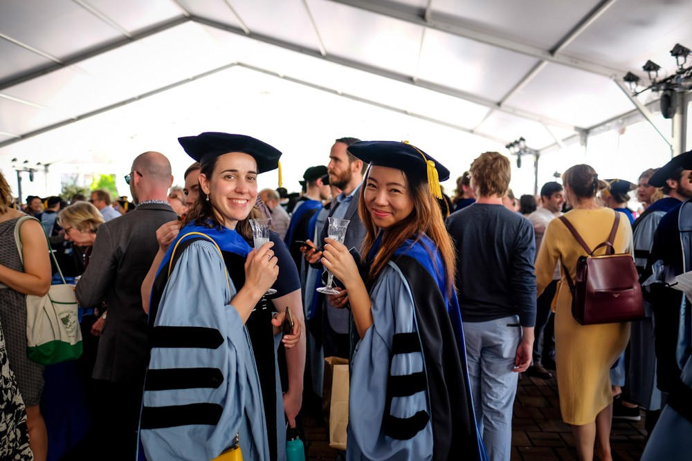 Doctoral graduates celebrate at the reception at Ancel Plaza. Doctoral graduates celebrate at the reception at Ancel Plaza.