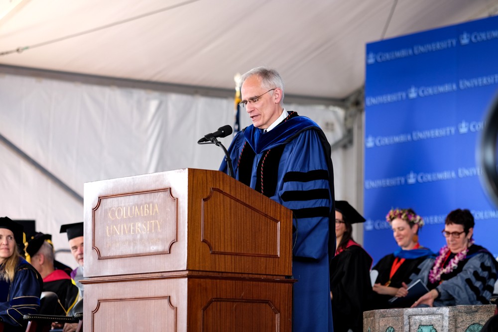 Dean Alonso congratulates the MA candidates.