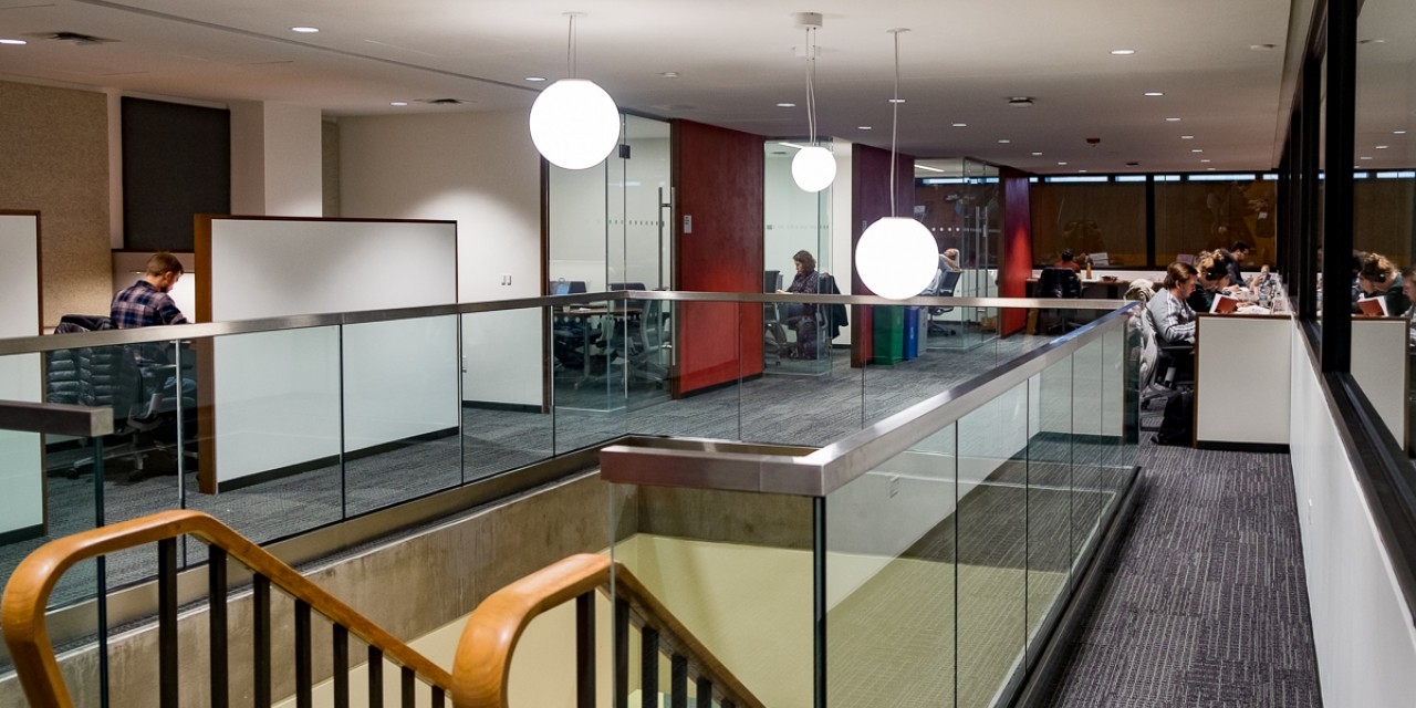 GSAS Writing Studio A library-like work space filled with writers working at laptops.