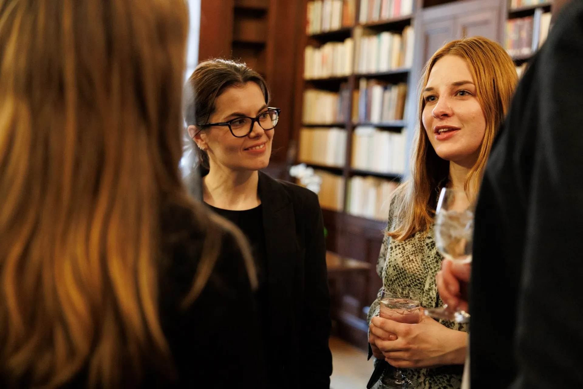 People standing and talking at a cocktail party