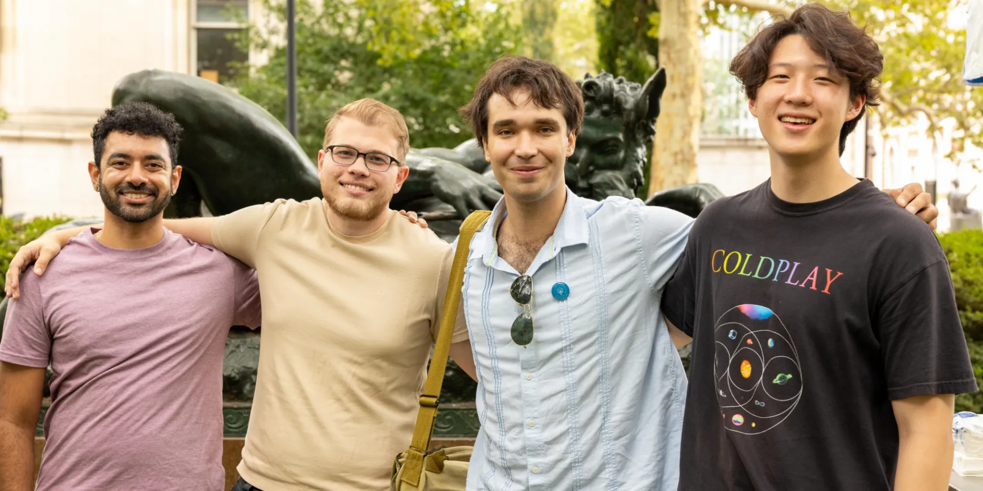 A group of students smile for the camera.