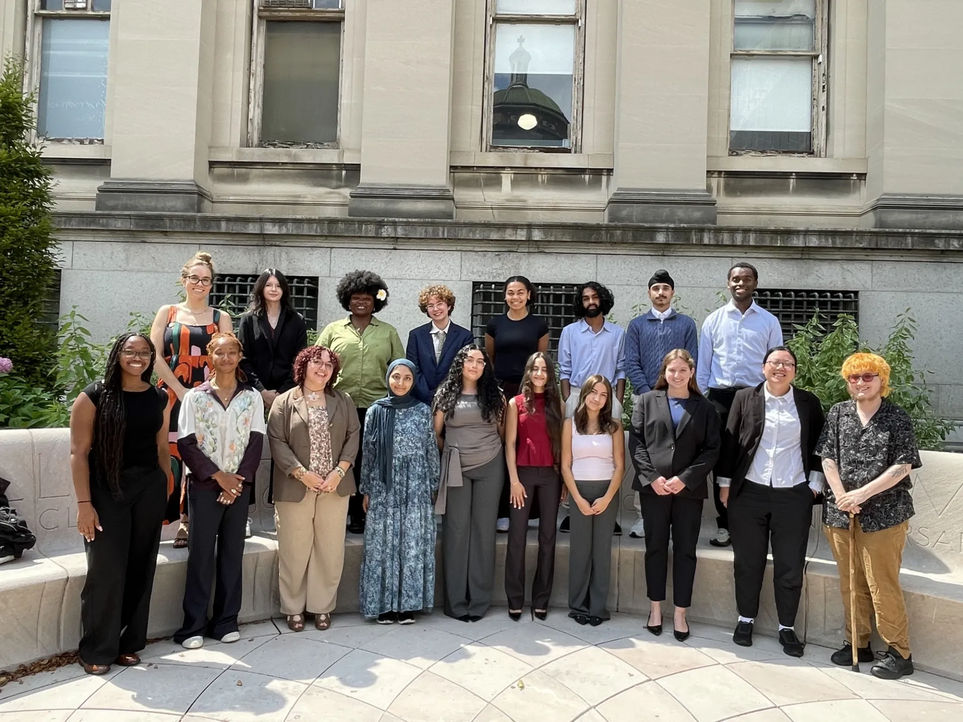 A group of students pose for a group photo on Columbia's campus.